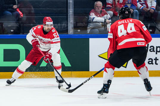 Felix Scheel of Denmark and Morgan Rielly of Canada