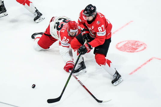 Markus Lauridsen of Denmark and Sidney Crosby of Canada