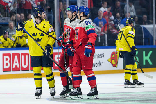 Oliver Ekman-Larsson of Sweden with Marek Alscher and David
