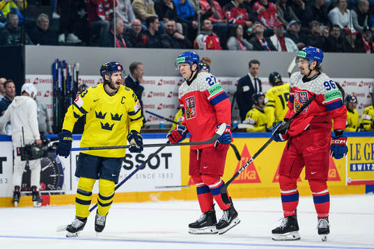 Oliver Ekman-Larsson of Sweden with Marek Alscher and David