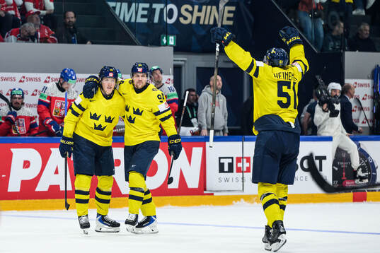 Simon Holmström and Joel Persson of Sweden celebrate the