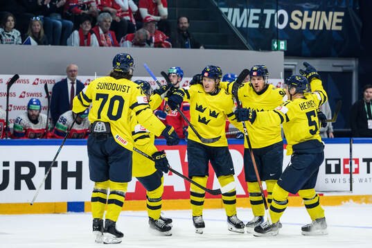 Simon Holmström of Sweden celebrate with team mates