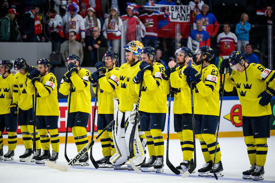 Goaltender Magnus Hellberg and Jack Berglund of Sweden
