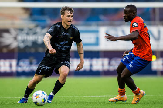 Martin Hellan of Brann and Uba Charles of Aalesund