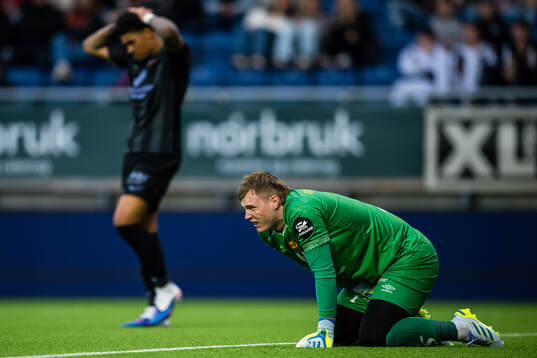 Goalkeeper Kristoffer Klaesson of Aalesund in pain