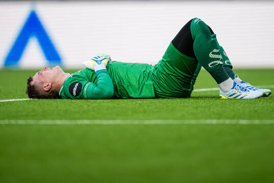 Goalkeeper Kristoffer Klaesson of Aalesund in pain