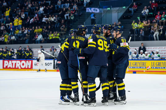 Jacob De La Rose of Sweden celebrating with team mates