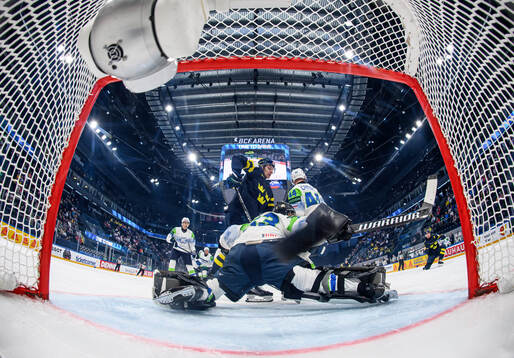 Lucas Raymond of Sweden (r) scores the 1-0 goal against