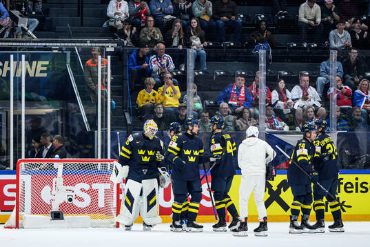 Goaltender Arvid Söderblom of Sweden celebrate with team