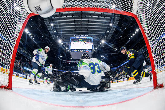 goaltender Zan Us of Slovenia and Emil Heineman of Sweden