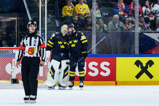 goaltender Arvid Söderblom and Mattias Ekholm of Sweden