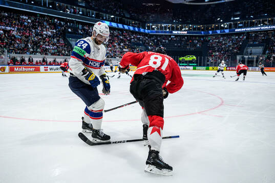 Jacob Berglund of Norway and Dylan Holloway of Canada