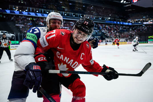 Eirik Salsten of Norway and Macklin Celebrini of Canada