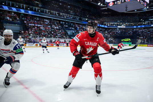 Eirik Salsten of Norway and Macklin Celebrini of Canada