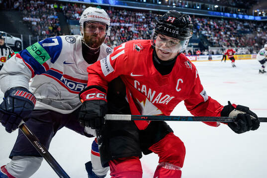Eirik Salsten of Norway and Macklin Celebrini of Canada