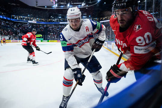 Max Krogdahl of Norway and Ryan O'Reilly of Canada