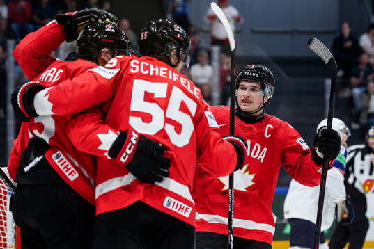 Macklin Celebrini of Canada celebrates the 3-3 goal scored