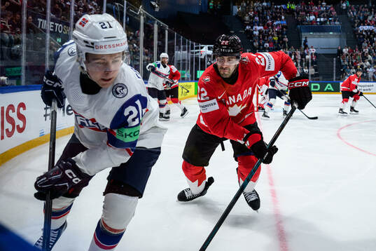 Mikkel Eriksen of Norway and Evan Bouchard of Canada