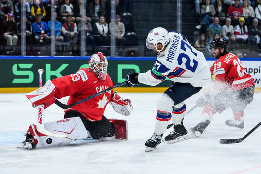 Cam Talbot of Canada and Andreas Martinsen of Norway