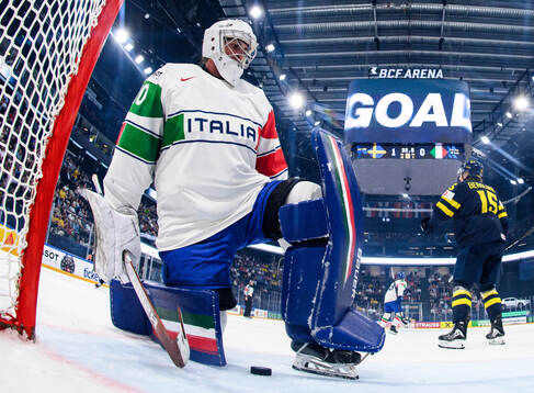 Goaltender Damian Clara of Italy looks dejected