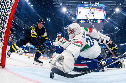 Jakob Silfverberg of Sweden and goaltender Damian Clara of