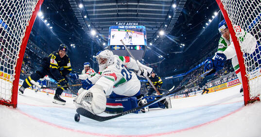 Jakob Silfverberg of Sweden and goaltender Damian Clara of