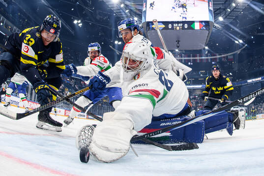 Jakob Silfverberg of Sweden and goaltender Damian Clara of