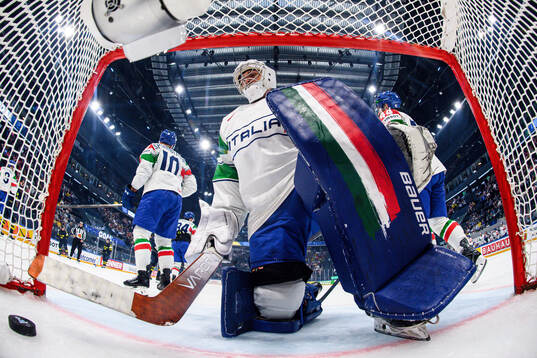 goaltender Damian Clara of Italy looks dejected