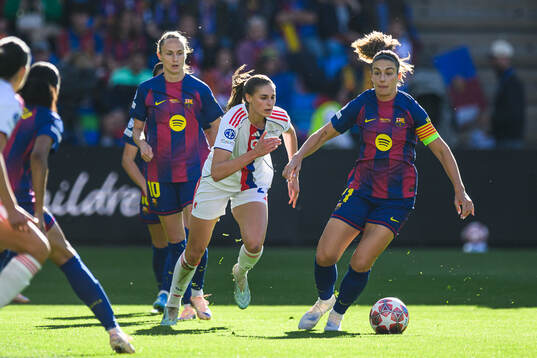 Jule Brand of Lyon and Alexia Putellas of Barcelona