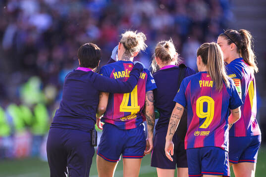 Mapi Leon of Barcelona receives medical attention