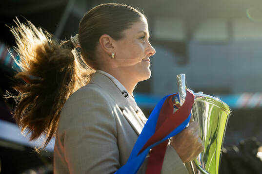 Maren Mjelde, UEFA ambassador, with the trophy