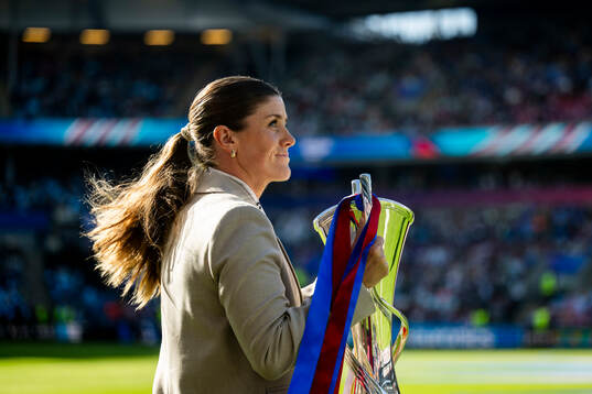 Maren Mjelde, UEFA ambassador, with the trophy