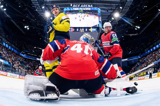 Linus Karlsson of Sweden against goaltender Henrik