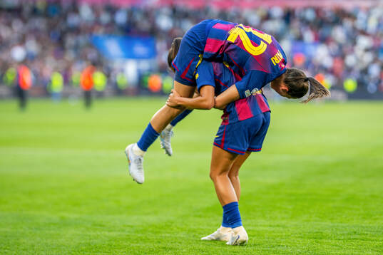Patri Guijarro and Kika Nazareth of Barcelona celebrate