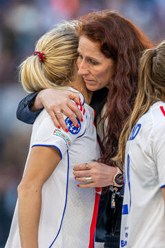 Ada Hegerberg of Lyon and Lise Klaveness, president of the