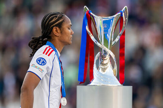 Wendie Renard of Lyon looks dejected as she walks past the