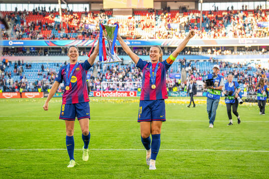 Marta Torrejon and Alexia Putellas of Barcelona celebrate