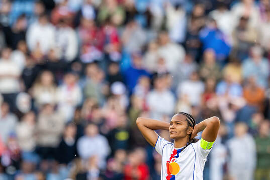 Wendie Renard of Lyon looks dejected
