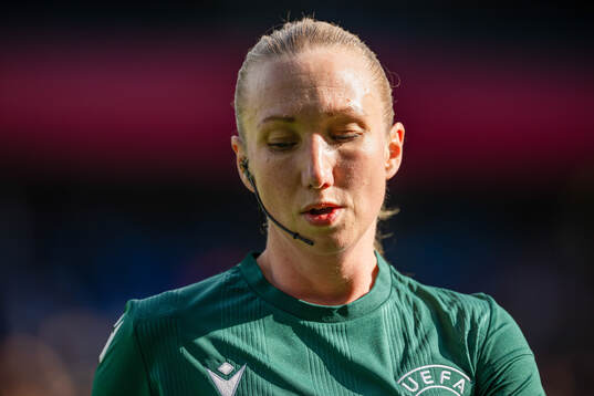 Assistant referee Monica Løkkeberg warms up