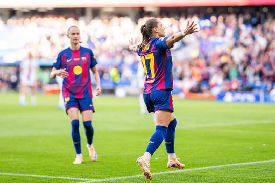 Ewa Pajor of Barcelona celebrates with teammate Caroline