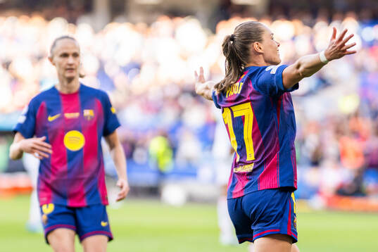 Ewa Pajor of Barcelona celebrates with teammate Caroline