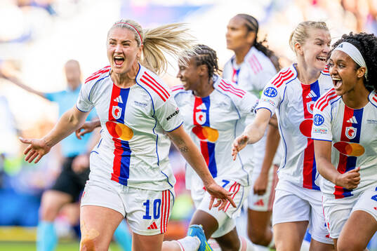 Lindsey Heaps of Lyon celebrates with Lily Yohannes and