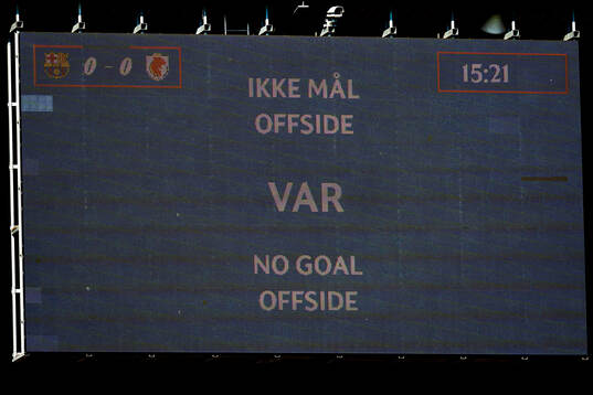 A screen shows the VAR decision disallowing a goal for