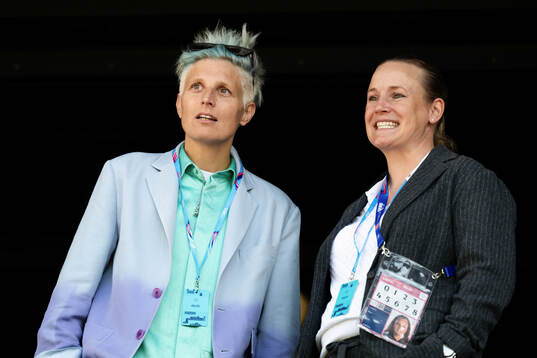 Lisa Ek, agent, and Nora Häuptle in the stands