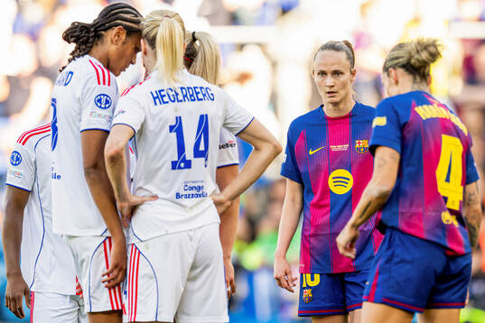 Ada Hegerberg of Lyon and Caroline Graham Hansen of