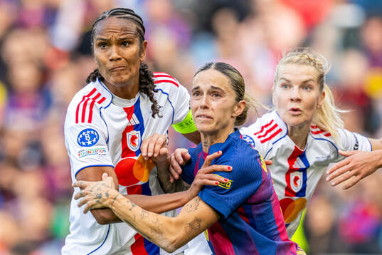 Wendie Renard of Lyon and Mapi Leon of Barcelona
