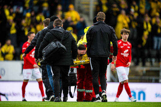 Sondre Brunstad Fet of Bodø/Glimt is carried of the pitch