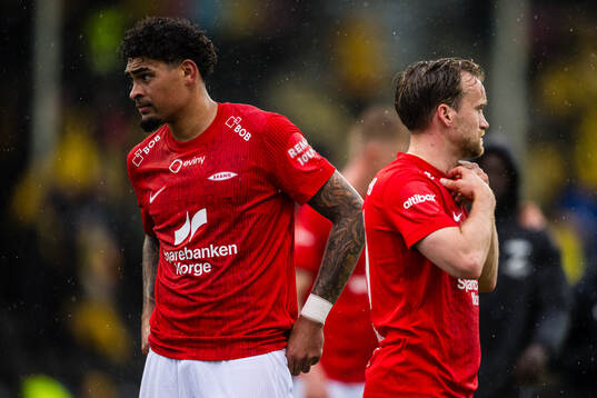 Noah Jean Holm and Bård Finne of Brann looks dejected