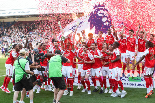 Martin Ødegaard of Arsenal celebrates with the trophy for