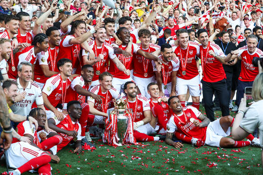 Martin Ødegaard of Arsenal celebrates with the trophy for
